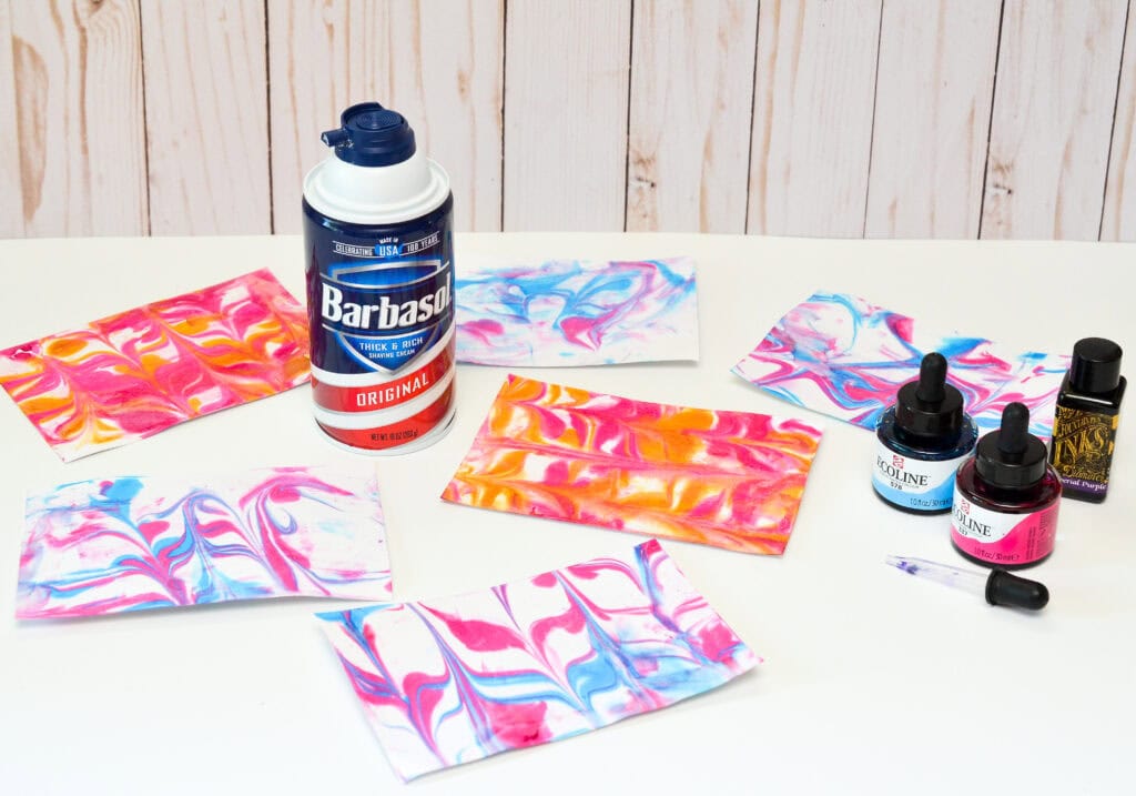4x6 pieces of marbled cardsstock made with shaving cream and paint