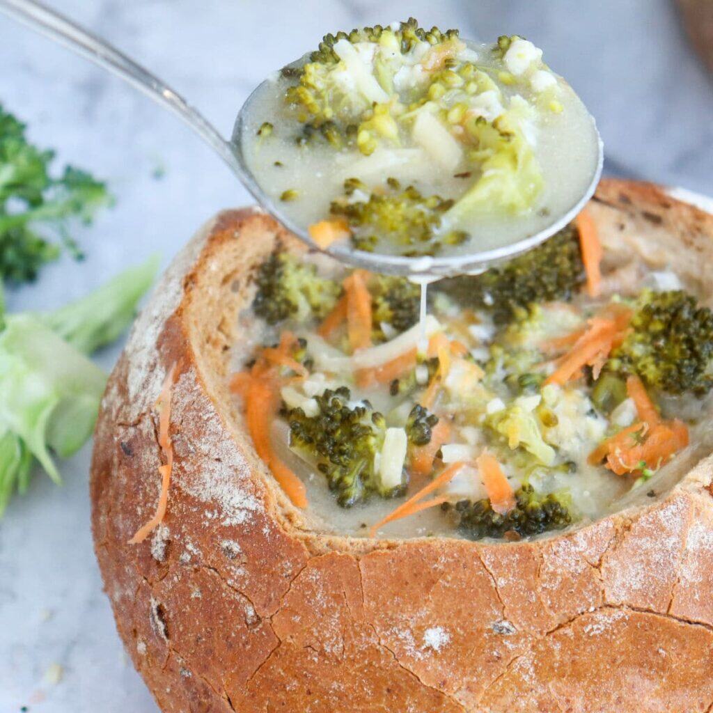 broccoli cheddar cheese souip in bread bowl